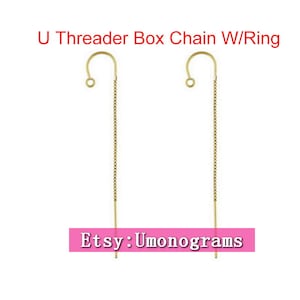 May include: Two gold U-shaped earring threaders with a box chain and a ring at the top. The chains are approximately 5 cm long. Etsy: Umonograms