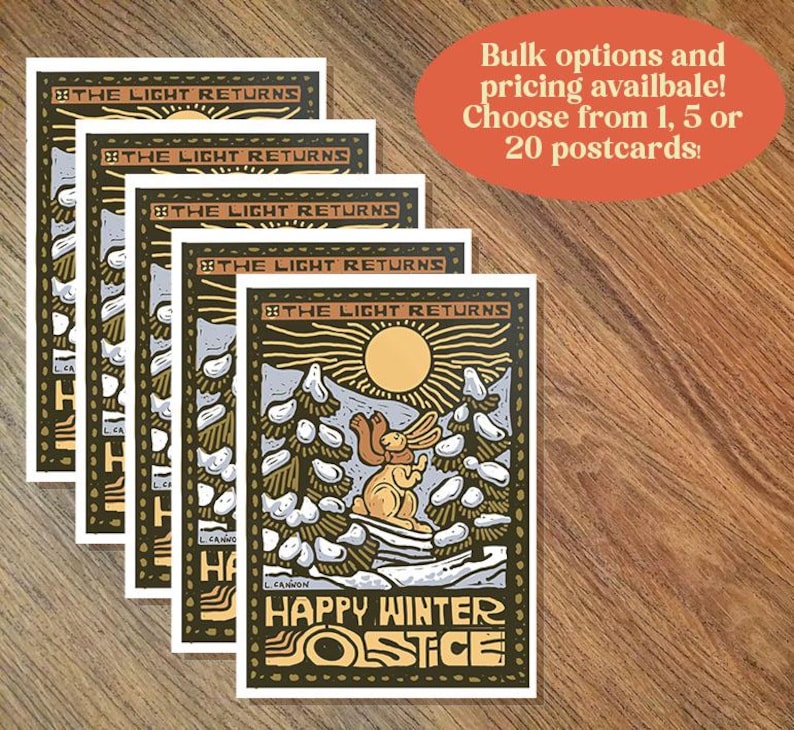 May include: A stack of five postcards featuring a woodblock style illustration of a rabbit in a snowy forest with the text "The Light Returns" and "Happy Winter Solstice".