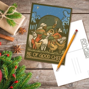 May include: A vintage-style postcard featuring a colorful illustration of a group of people and animals gathered around a star. The text on the postcard reads "Be of good cheer".
