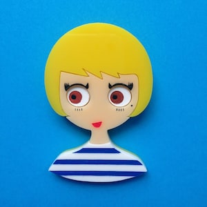 AMY Acrylic Brooch, Short haired girl wearing a sailor top.