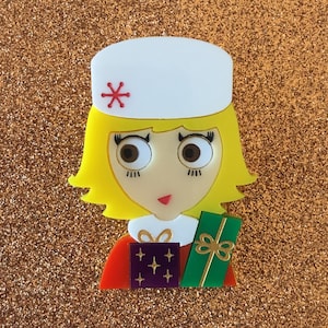 MEG Acrylic Limited Edition Brooch, back from Christmas shopping. White hat and arms full of xmas presents