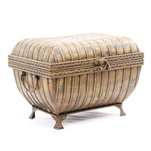 May include: A vintage-style, brass-toned chest with a curved, ribbed body and a hinged lid. The chest features decorative rope-like trim, a clasp closure, and small, ornate feet. It has a handle on one side and is likely used for storage.