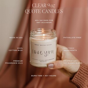 May include: A clear glass candle jar with a white label that reads "love you". The candle is made with a soy blend and has a mahogany, lavender, wood, and geranium scent. It is phthalate free and has a 100% cotton wick. The candle has a burn time of 40+ hours.