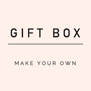 May include: A black and white graphic design with the text "GIFT BOX MAKE YOUR OWN" on a light pink background.