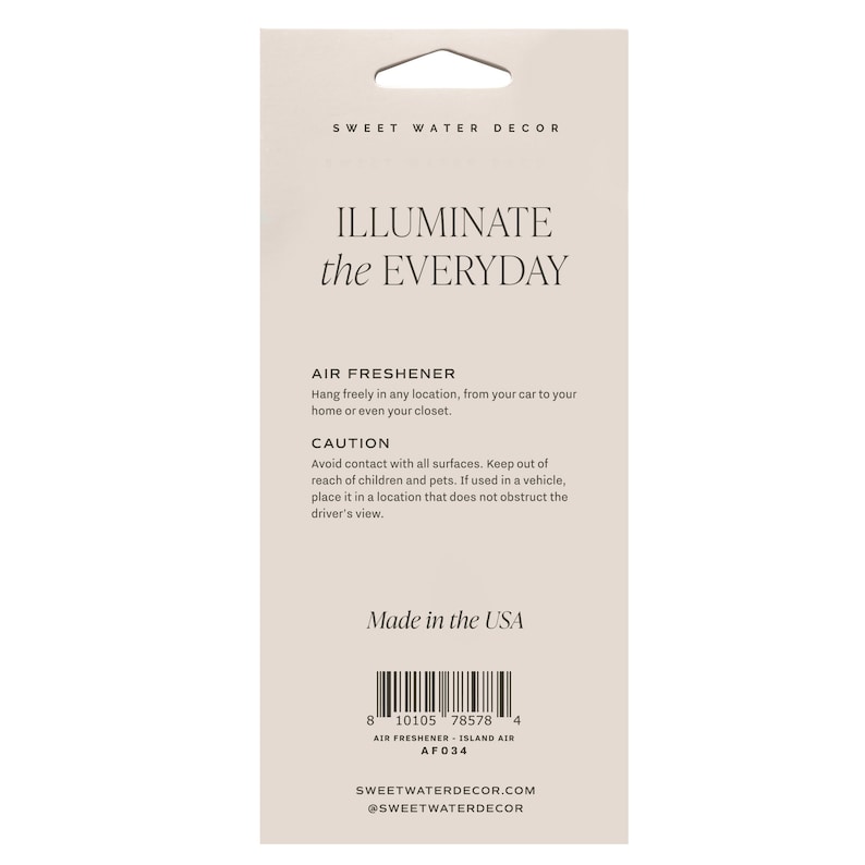 May include: A rectangular air freshener package with a die-cut hole for hanging. The package is light beige with the text "ILLUMINATE the EVERYDAY" and "AIR FRESHENER." It includes a caution notice and the text "Made in the USA."