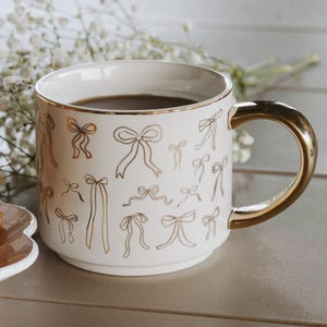 All Over Bows Mug: 14oz Coffee Mug, Fine Bone China with Gold Handle