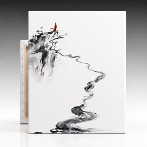 May include: A rectangular canvas print featuring a black and white ink wash painting of a cliffside landscape. A single figure in a bright red robe stands at the edge of the cliff, overlooking a winding path that leads down into the white space.