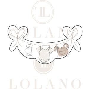 May include: A banner-shaped cookie cutter featuring baby clothes hanging on a clothesline. The design includes a diaper, onesie, and bib, all in a neutral color palette. The banner is adorned with heart-shaped bows on each end.