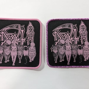 May include: Two black fabric patches with pink embroidered edges. The patches feature a band logo with the word "DEATH" in a gothic font and a skeletal figure holding a scythe. The logo is surrounded by a group of cats.
