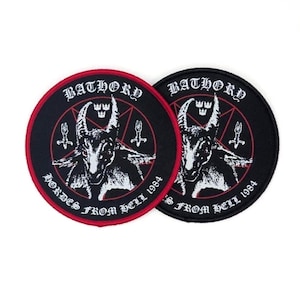 May include: Two circular embroidered patches featuring a black background with a white goat head illustration centered within a red pentagram. The text BATHORY and HORDES FROM HELL 1984 is printed in white gothic lettering around the central design.