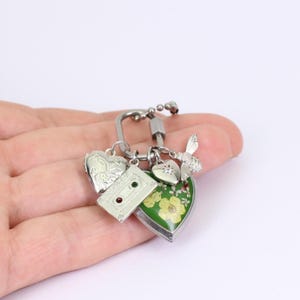 Customisable Carabiner Bag Charm with Handmade Real Pressed Flower Locket, by Detail London.