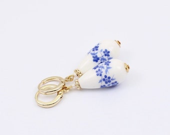 Delft Style Ceramic Huggie Hoop Earrings, Gold Plated with Floral Blue and White Drop Beads, Handmade by Detail London.