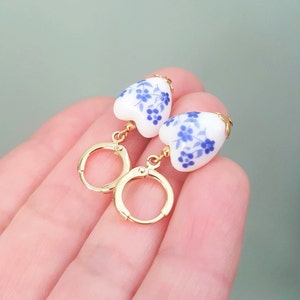 Bue and White Floral Ceramic Heart Shaped Bead Huggie Hoop Earrings, 18K Gold Plated Brass, Handmade Hoop Earrings by Detail London.