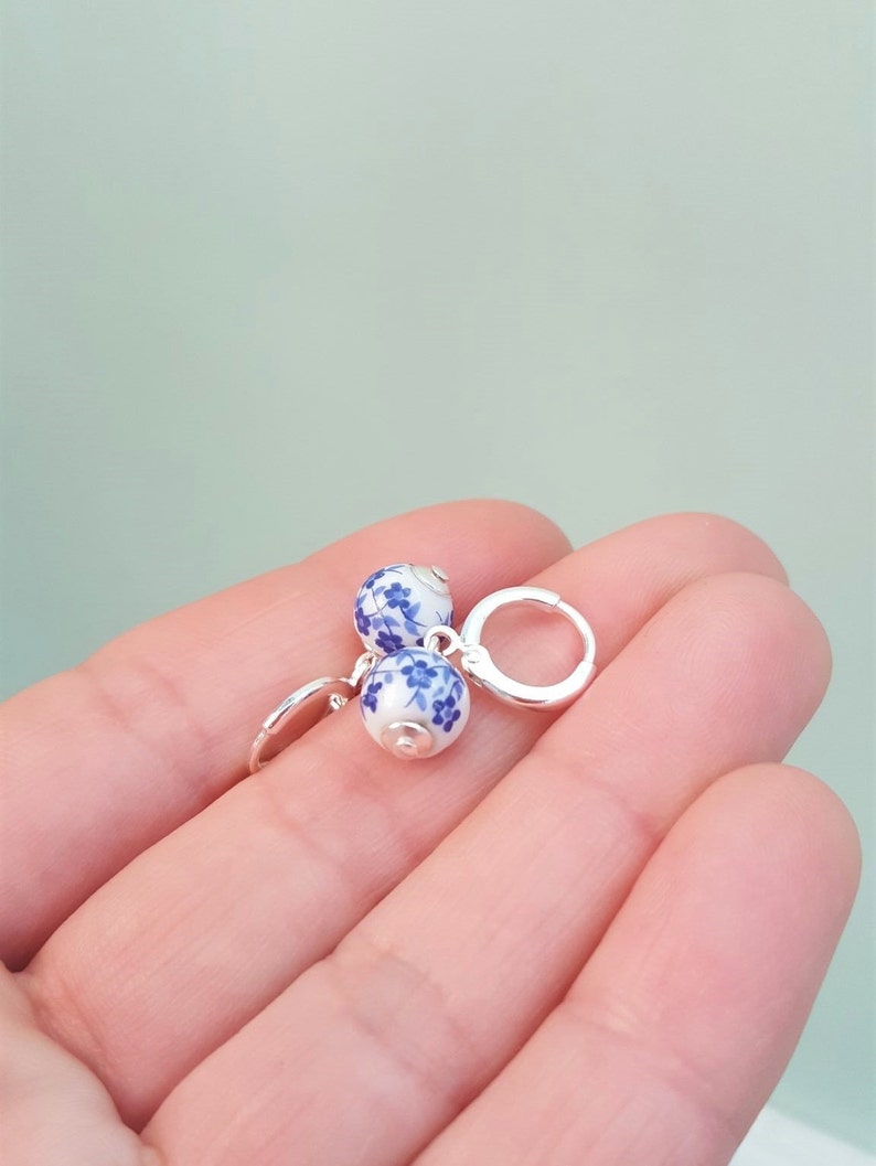 Blue & White Floral Ceramic Bead Charm Huggie Hoops, Choose 18K Gold Plated or Silver Plated, Handmade Hoop Earrings by Detail London. image 4