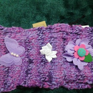 Hand knitted purple ladies headband with flowers, and butterfly design