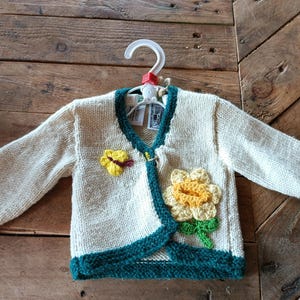 Hand Knitted Childrens Wool Cardigan.  With flower and Rabbit Design