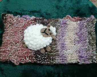 Hand knitted ladies brightly coloured headband with Sheep decoration.