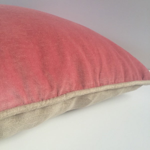 Luxurious dusty pink velvet cushion with linen back and piping.