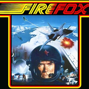 May include: A vintage video game box art featuring a fighter jet flying over a snowy landscape. The title "FIREFOX" is displayed in red and yellow letters. A pilot wearing a helmet with a red star is in the foreground.