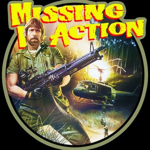 May include: A circular image with a green background featuring a man holding a large machine gun. The man is wearing a green military uniform and has a beard. The text "MISSING IN ACTION" is written in yellow letters across the top of the image.