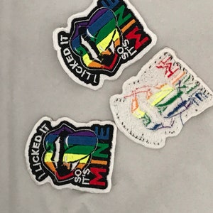 May include: Three embroidered patches with a rainbow design and the text "It's so mine" and "I licked it" on a white background.