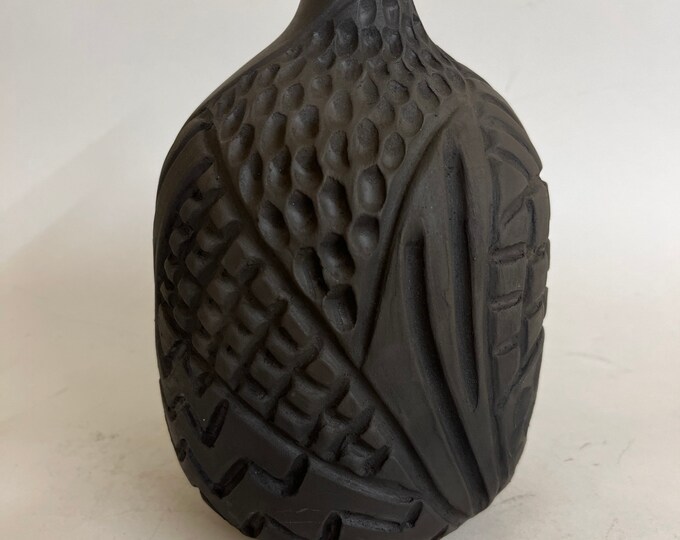 Black carved vessel