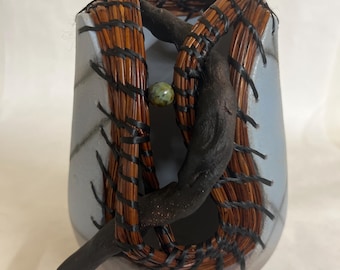 Saggar vessel with pine needles and clay branch