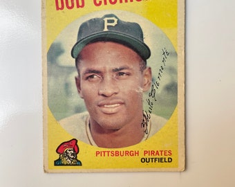 1959 Topps baseball trading card features the legendary Roberto Clemente of the Pittsburgh Pirates. See photos for condition