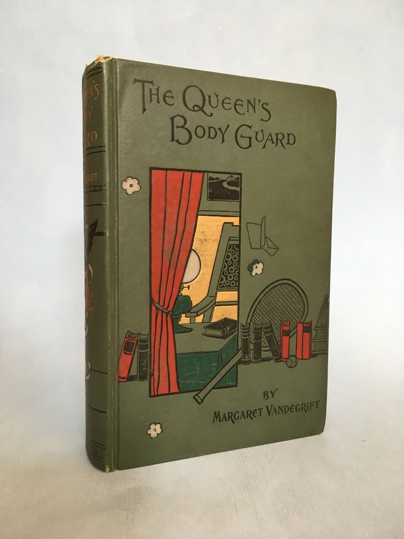 May include: An antique book titled "The Queen's Body Guard" by Margaret Vandegrift. The cover is a muted green with a colorful illustration of a room with a window, red curtains, and a tennis racket. The book's spine shows the title and author.