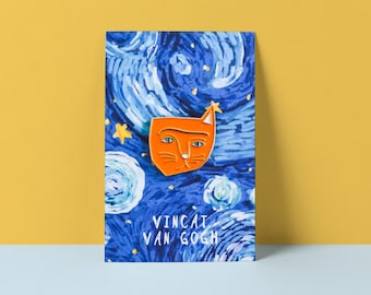 May include: An orange cat-shaped enamel pin with a star, set against a blue and white starry night background. The pin is on a card with the text "Vincat Van Gogh". The background is reminiscent of Van Gogh's "Starry Night" painting.