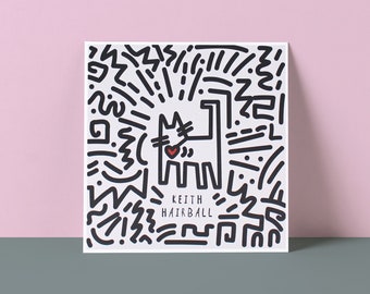 May include: Black and white illustration of a cat with a red heart on a white background. The illustration is surrounded by black lines and shapes. The text "KEITH HAIRBALL" is below the cat.