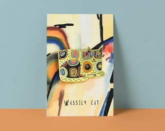 May include: A gold-coloured enamel pin depicting a stylised cat with a colourful geometric pattern. The cat is lying down and has a playful expression. The pin is on a white background with the text "WASSILY CAT" below it.