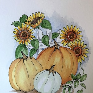 May include: A watercolor painting of three pumpkins and sunflowers. The pumpkins are different sizes and colors, with one being white, one being orange, and one being yellow. The sunflowers are yellow with brown centers. The pumpkins are in front of a white picket fence.