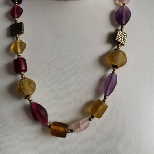 Lovely beaded necklace. Gold, pink, purple beads. 60cm long with extension.