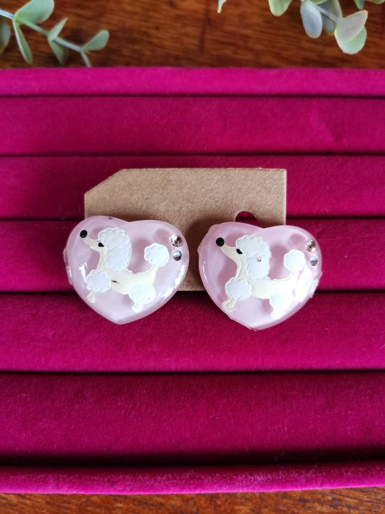 Kitschy pink poodle earrings bakelite plastic rockabilly. Vintage poodle clip on earrings diamonte