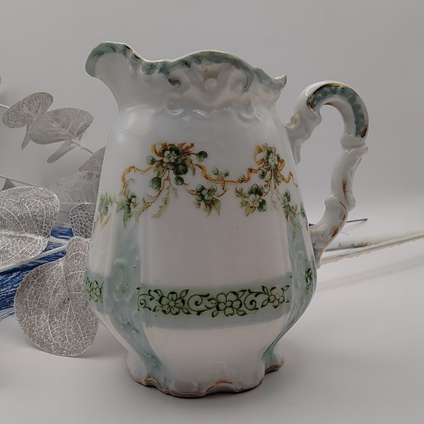 Beautiful antique Herman Ohme milk jug. Delicate piece, sage green ribbon floral design. 1882.