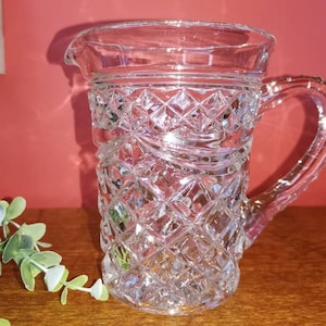 Lovely cut glass crystal water, lemonade jug, ornate handle, criss Cross cut and swag design. 14cm high.
