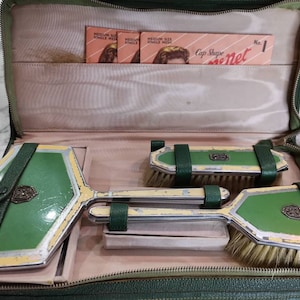 Wonderful 1930s vintage travel vanity dressing table set. Enamelled and marcasite in leather case. Hair nets included.