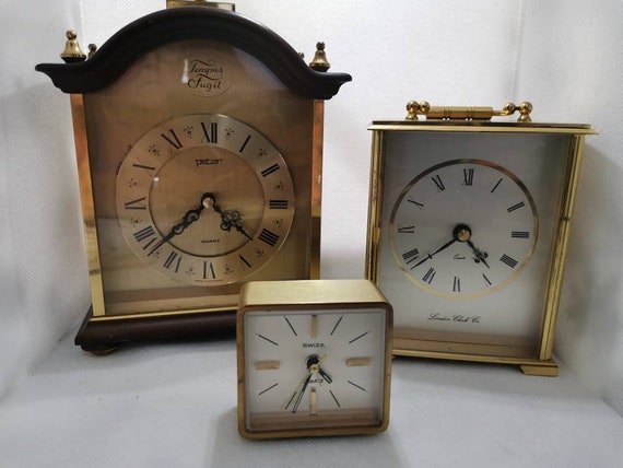 Wonderful set of three vintage brass clocks. All working order. Tempus Fugit, London Clock co., Swiza.