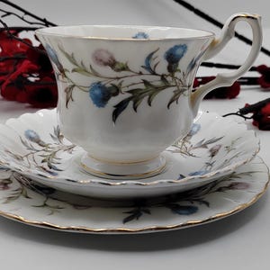 Wonderful selection of Royal Albert Brigadoon bone china. Thistles blue and mauve. Scottish theme.