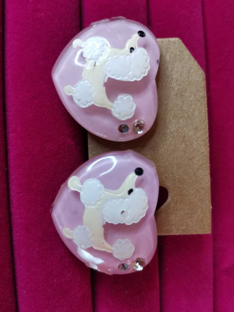 Kitschy pink poodle earrings bakelite plastic rockabilly. Vintage poodle clip on earrings diamonte