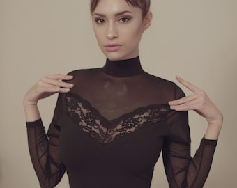 Sexy Long sleeved Bodysuit. Lace transparent Inserts. Beautiful and Stylish.  Easy open fasteners. Thong Style.