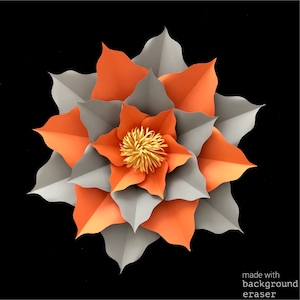 May include: A large paper flower with orange and gray petals. The center of the flower is yellow.