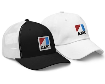 May include: Two baseball caps, one black with a white mesh back and one white. Both caps feature a red, white, and blue logo with the letters "AMC" in black.