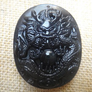 Natural  obsidian pendant carved ancient Chinese dragon head mascot