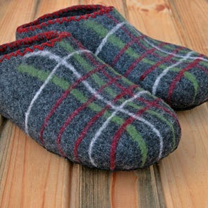 May include: A pair of gray wool slippers with a red, green, and white plaid pattern.