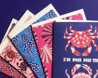 Postcards with marine-themed messages: octopus, crab, love on the beach, I'm smitten with you