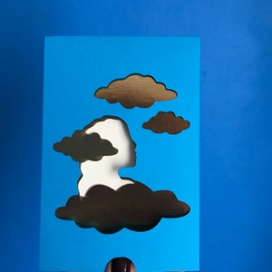 Carte de voeux La tête dans les nuages