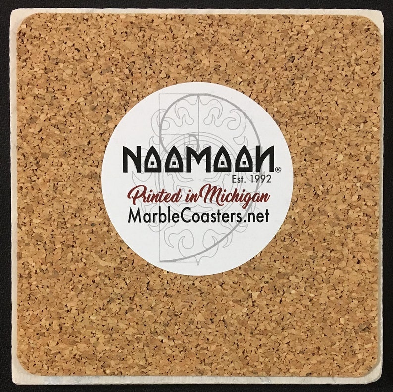 May include: A cork coaster with a white circle sticker that says "Naamaah" with a registered trademark symbol, "Est. 1992", "Printed in Michigan", and "MarbleCoasters.net".