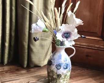 large pottery vase with handle decorated with a hand painted glazed wild meadow country design